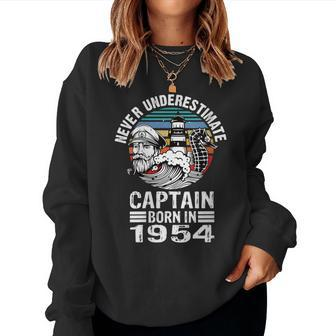 Never Underestimate Captain Born In 1954 Captain Sailing Women Sweatshirt | Mazezy