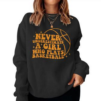 Never Underestimate A Girl Who Plays Basketball Groovy Women Sweatshirt | Mazezy