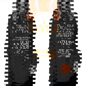 Never Underestimate A Nurse With A Broom Women Sweatshirt | Mazezy