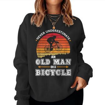 Never Underestimate An Old Man On A Bicycle Retired Cyclist Women Sweatshirt - Seseable