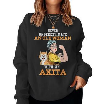 Never Underestimate An Old Woman With An Akita Women Sweatshirt | Mazezy