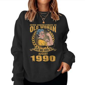 Never Underestimate Old Woman Born In August 1990 Women Sweatshirt | Mazezy