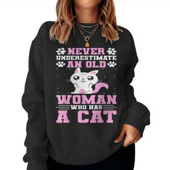 Never Underestimate An Old Woman Who Has A Cat Women Sweatshirt | Mazezy
