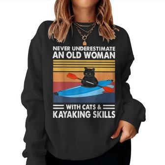 Never Underestimate An Old Woman With Cats & Kayaking Skills Women Sweatshirt | Mazezy