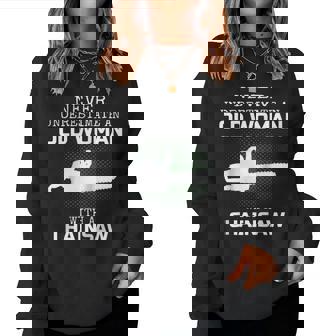 Never Underestimate An Old Woman With A Chainsaw Womens Old Woman Women Sweatshirt | Mazezy