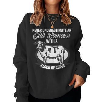 Never Underestimate An Old Woman With A Flock Of Cows Women Sweatshirt - Monsterry