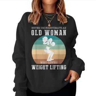 Never Underestimate An Old Woman Who Loves Lifting Women Sweatshirt - Thegiftio UK