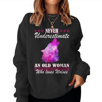 Never Underestimate An Old Woman Who Loves Wolves Women Sweatshirt - Thegiftio UK