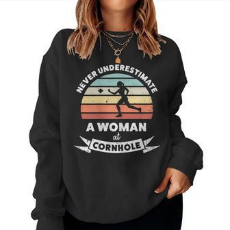 Never Underestimate A Woman At Cornhole Women Sweatshirt | Mazezy