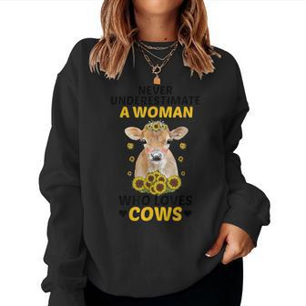 Never Underestimate A Woman Who Loves Cows Farming Lover Women Sweatshirt - Seseable