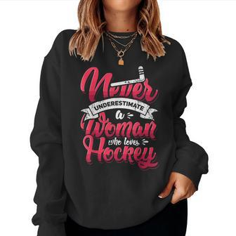 Never Underestimate A Woman Who Loves Hockey Ice Hockey Women Sweatshirt | Mazezy