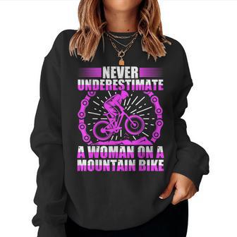 Never Underestimate A Woman On A Mountain Bike Women Sweatshirt - Monsterry CA