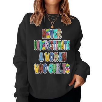 Never Underestimate A Woman Who Quilts Patchwork Letters Women Sweatshirt - Monsterry UK