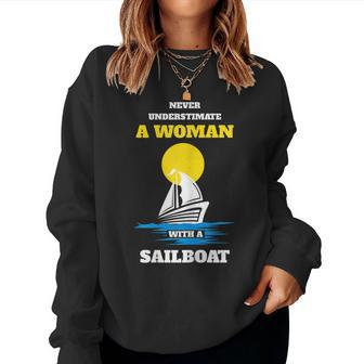Never Underestimate A Woman With A Sailboat Women Sweatshirt - Seseable