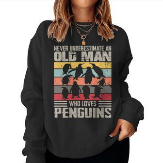 Vintage Never Underestimate An Old Man Who Loves Penguins Women Sweatshirt | Mazezy