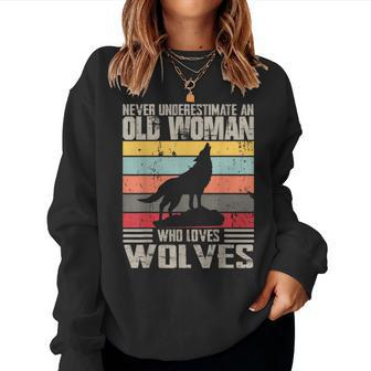 Vintage Never Underestimate An Old Woman Who Loves Wolves Women Sweatshirt | Mazezy