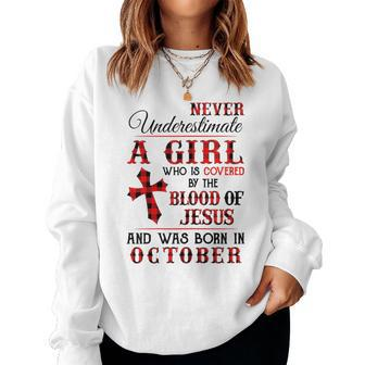 A Girl Covered The Blood Of Jesus And Was Born In October Women Crewneck Graphic Sweatshirt - Seseable