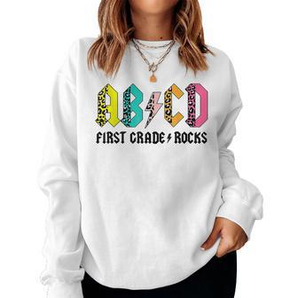 Abcd First Grade Rocks Back To School 1St Grade Teacher Women Crewneck Graphic Sweatshirt - Monsterry