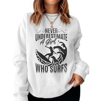 Big Wave Surfing Girls Never Underestimate A Girl Who Surfs Gift For Womens Women Crewneck Graphic Sweatshirt - Seseable