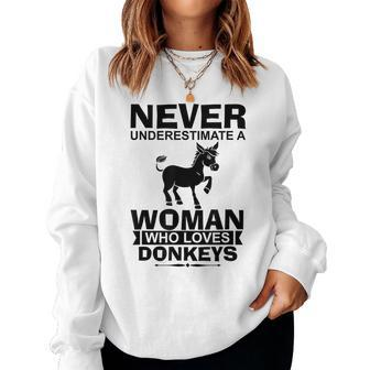 Donkey Lover Funny Gift Never Underestimate A Woman Who Women Crewneck Graphic Sweatshirt - Seseable