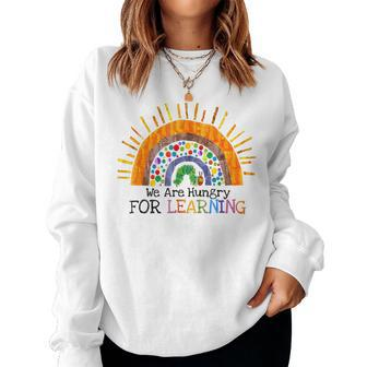 We Are Hungry For Learning Rainbow Caterpillar Teacher Women Sweatshirt - Monsterry