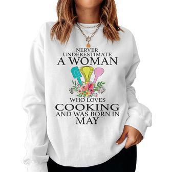May Girl Never Underestimate A Woman Who Loves Cooking Women Sweatshirt | Mazezy