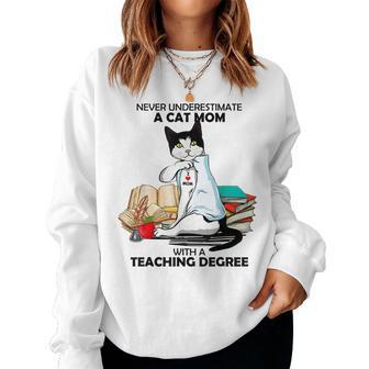 Never Underestimate A Cat Mom With A Teaching Degree Gift Women Crewneck Graphic Sweatshirt - Seseable