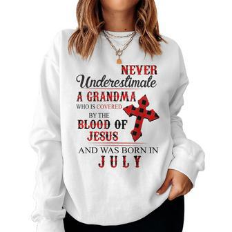 Never Underestimate A Grandma Who Is Covered Jesus In July Women Crewneck Graphic Sweatshirt - Seseable