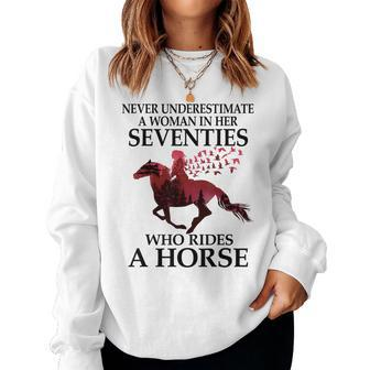 Never Underestimate A Woman In Her Seventies Rides A Horse Women Crewneck Graphic Sweatshirt - Seseable