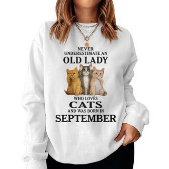 Never Underestimate An Old Lady Who Loves Cats September Gift For Womens Women Crewneck Graphic Sweatshirt - Seseable