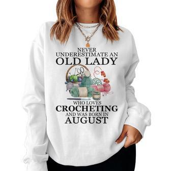 Never Underestimate An Old Lady Who Loves Crocheting August Women Crewneck Graphic Sweatshirt - Seseable