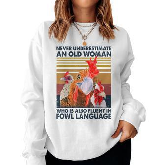 Never Underestimate An Old Woman Fluent In Fowl Language Women Crewneck Graphic Sweatshirt - Seseable