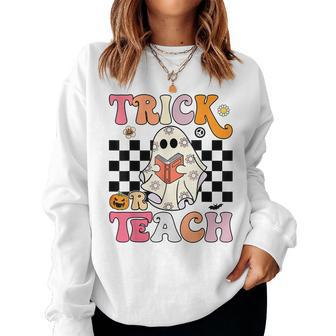 Trick Or Teach Groovy Halloween Retro Floral Ghost Teacher Women Sweatshirt | Mazezy
