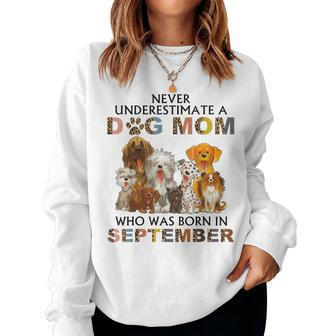 Never Underestimate A Dog Mom Who Was Born In September Women Sweatshirt - Seseable