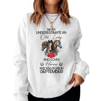 Never Underestimate An Old Lady Who Loves Horses September Women Sweatshirt | Mazezy