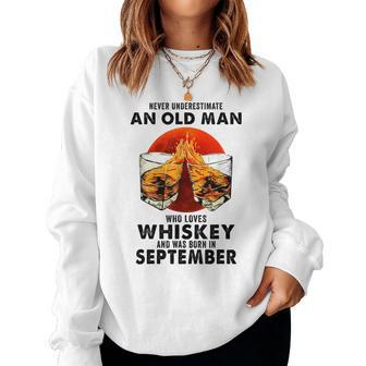 Never Underestimate An Old Man Who Loves Whiskey September Old Man Women Sweatshirt | Mazezy UK