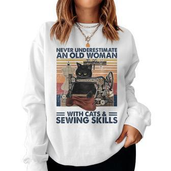 Never Underestimate An Old Woman With Cats And Sewing Skills Women Sweatshirt | Mazezy