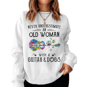 Never Underestimate An Old Woman With A Guitar And Dogs Women Sweatshirt - Monsterry AU