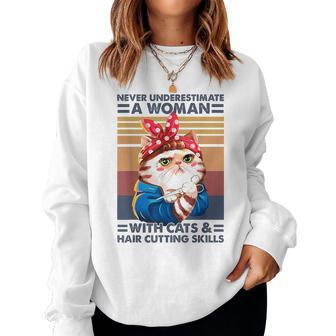 Never Underestimate A Woman With Cats And Hair Cutting Women Sweatshirt - Monsterry DE