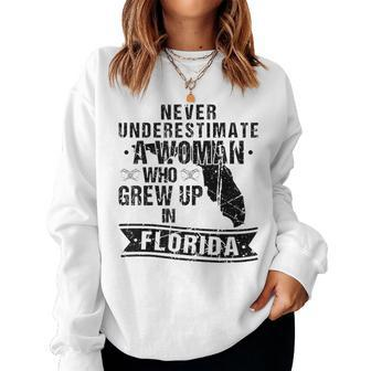 Never Underestimate A Woman Who Grew Up In Florida Women Sweatshirt | Mazezy
