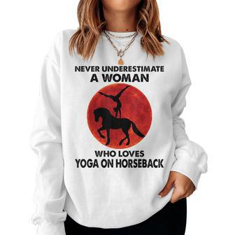 Never Underestimate A Woman Who Loves Yoga On Horseback Women Sweatshirt | Mazezy