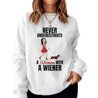 Never Underestimate A Woman With A Wiener Dachshund Women Sweatshirt - Seseable