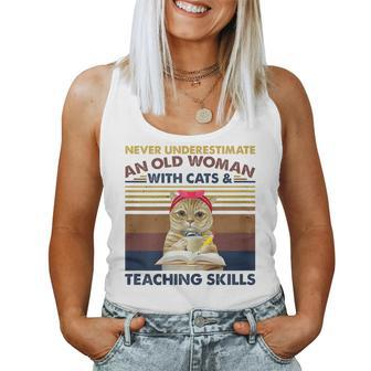 Never Underestimate An Old Woman With Cats & Teaching Skills Gift For Womens Women Tank Top Basic Casual Daily Weekend Graphic - Seseable