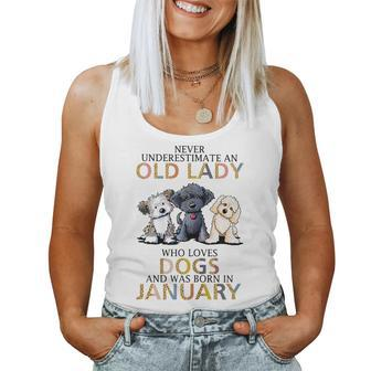 Never Underestimate Old Lady Loves Dogs Born In January Gift For Womens Women Tank Top Basic Casual Daily Weekend Graphic - Seseable