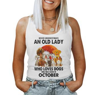 Never Underestimate An Old Lady Who Loves Dogs October Women Tank Top | Mazezy
