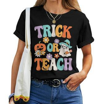 Groovy Halloween Trick Or Teach Retro Pumpkin Ghost Teacher Women T-shirt - Monsterry