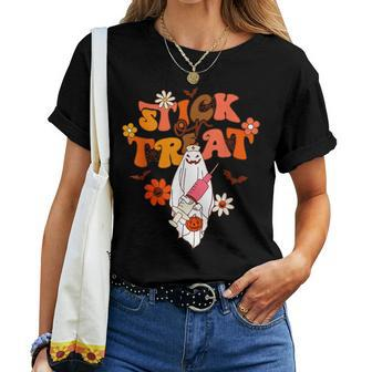 Groovy Stick Or Treat Er Tech Fall Autumn Nurse Halloween Women T-shirt - Seseable