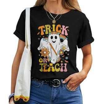 Halloween Trick Or Teach Groovy Retro Ghost Floral Teacher Women T-shirt - Thegiftio UK