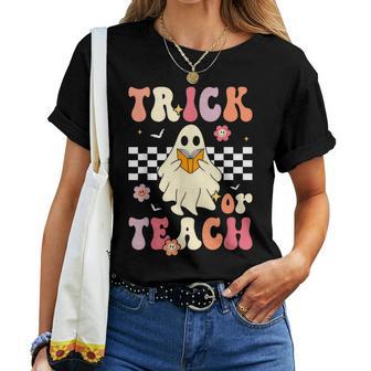 Trick Or Teach Groovy Halloween Retro Floral Ghost Teacher Women T-shirt - Seseable