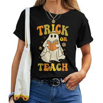 Trick Or Teach Groovy Halloween Retro Floral Ghost Teacher Women T-shirt - Monsterry AU